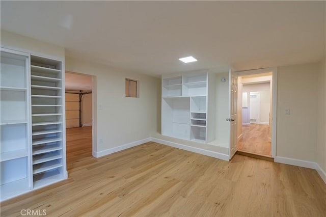 spare room with light hardwood / wood-style floors