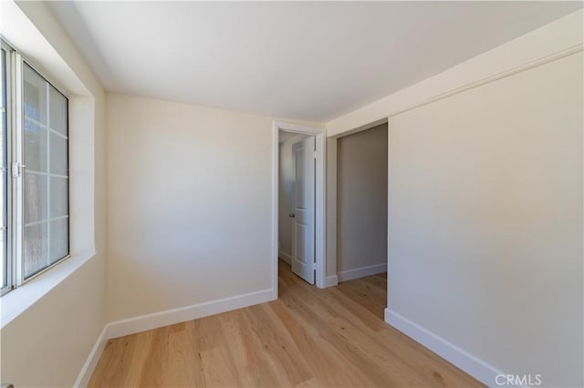 spare room featuring light hardwood / wood-style floors