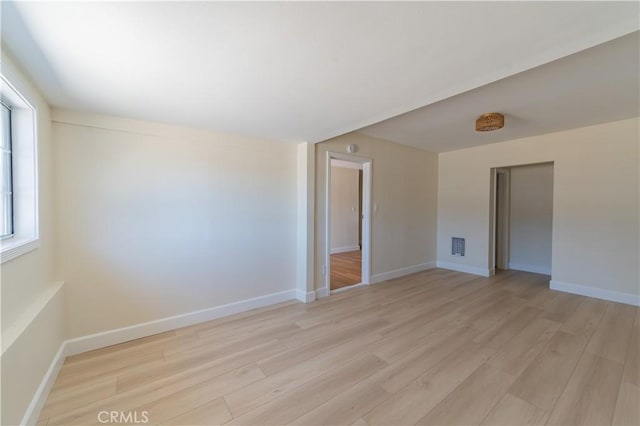 unfurnished room featuring light hardwood / wood-style floors