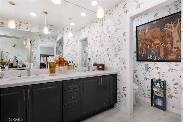 bathroom featuring tile patterned flooring, vanity, and toilet