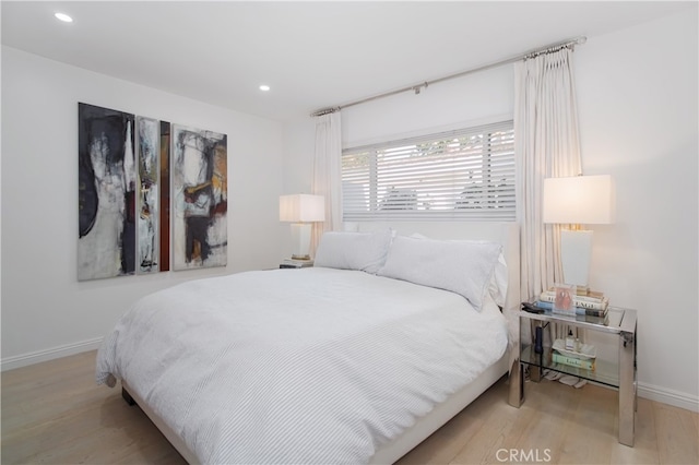 bedroom featuring light hardwood / wood-style floors