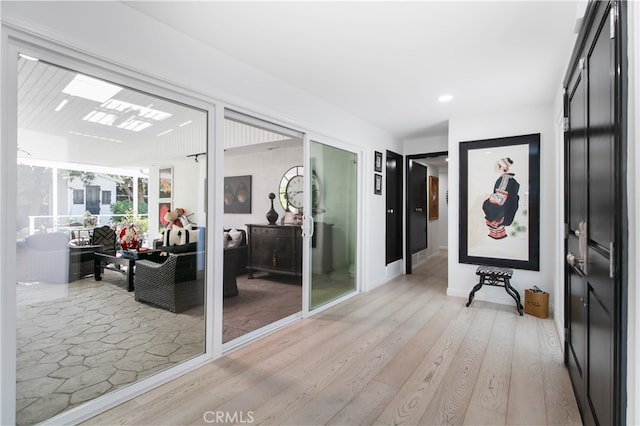 hallway featuring light hardwood / wood-style flooring