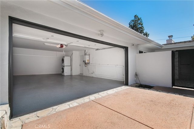 garage with a garage door opener, fridge, and water heater