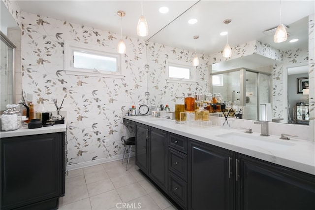 bathroom with vanity, tile patterned flooring, and a shower with shower door