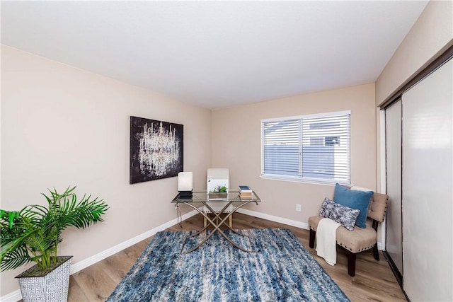 home office with light hardwood / wood-style floors