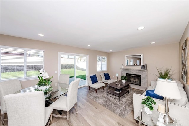 living room featuring a fireplace and light hardwood / wood-style floors