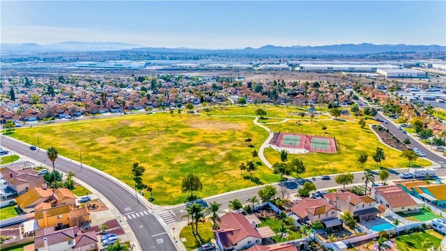 birds eye view of property with a mountain view