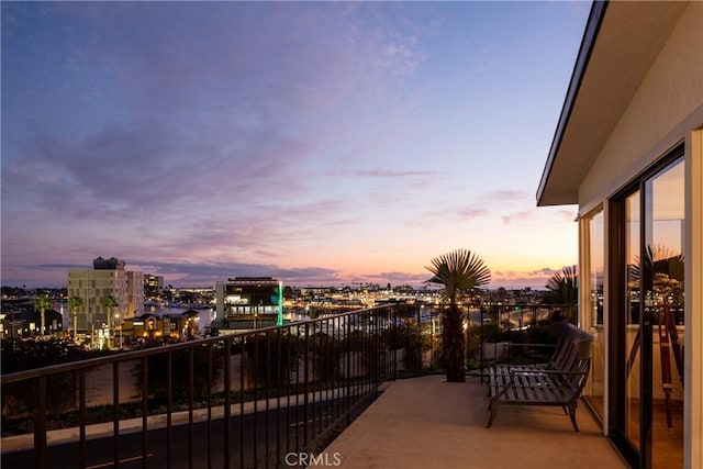 view of balcony at dusk