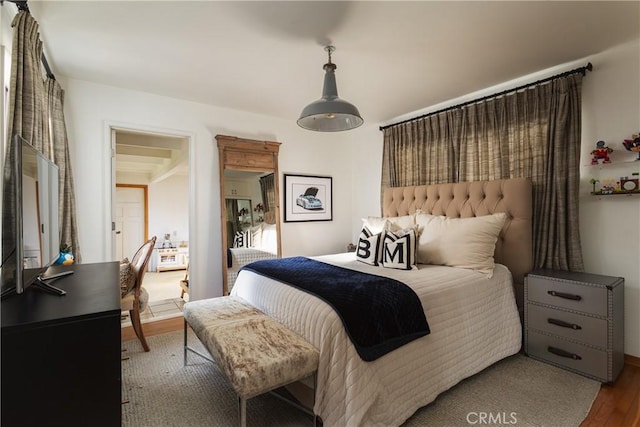 bedroom with wood finished floors