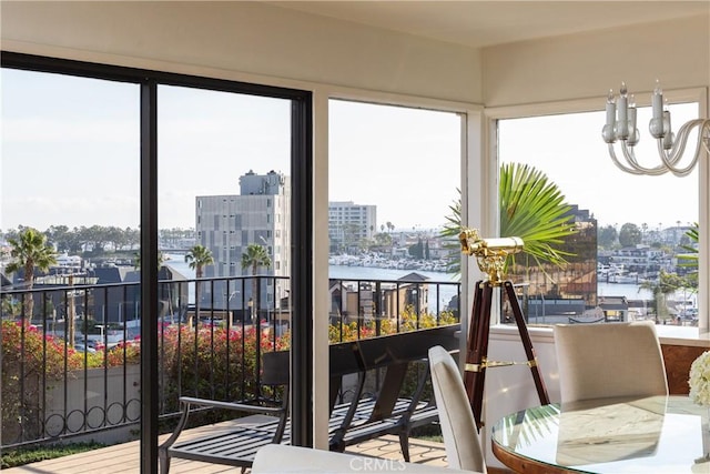 sunroom / solarium with a city view and a water view