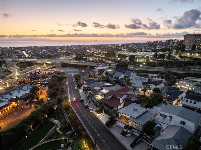 bird's eye view featuring a water view and a view of city