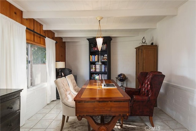 dining space with light tile patterned floors, wooden walls, and beam ceiling