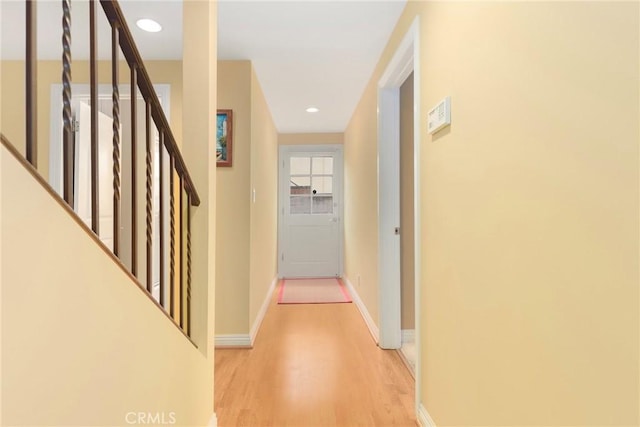 hall with light wood-type flooring