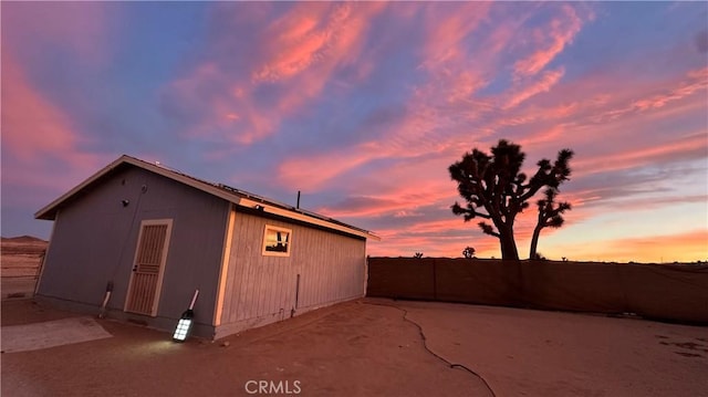 view of outdoor structure at dusk