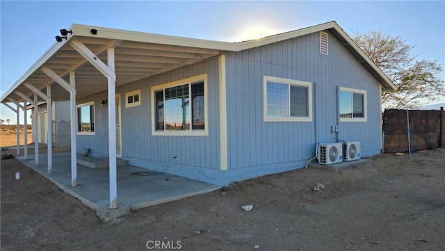 exterior space featuring ac unit and a patio area