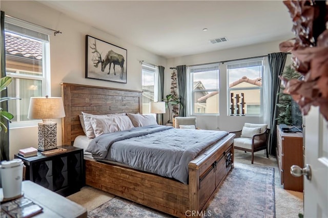 bedroom featuring light colored carpet