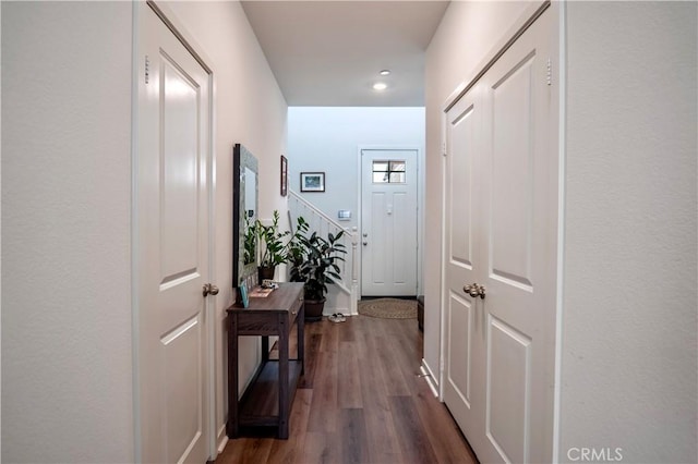 hallway with dark wood-type flooring