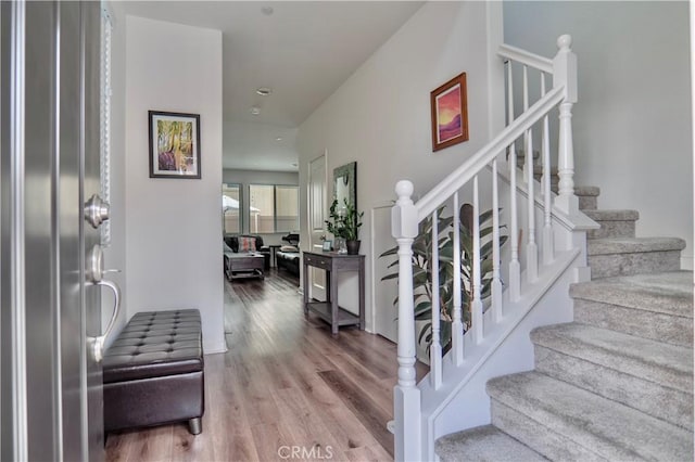 entryway with hardwood / wood-style flooring