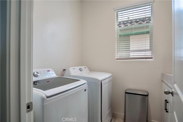 laundry room with separate washer and dryer