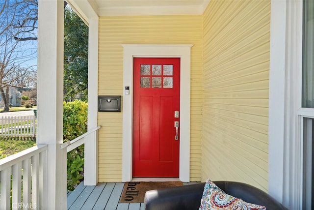 doorway to property featuring a porch