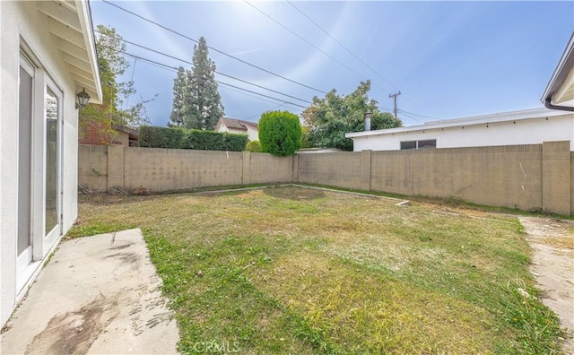 view of yard with a fenced backyard