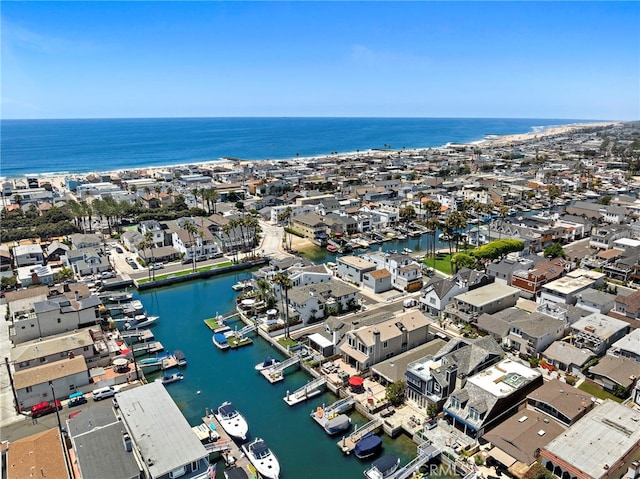 drone / aerial view featuring a residential view and a water view