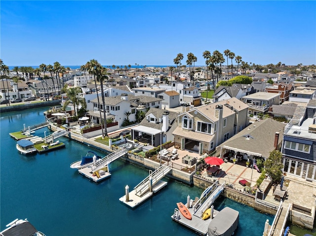 aerial view with a water view and a residential view