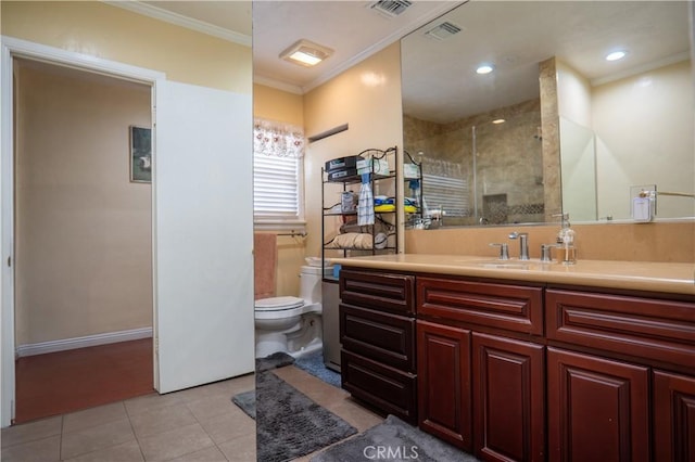 bathroom with tile patterned flooring, toilet, a shower with door, crown molding, and vanity