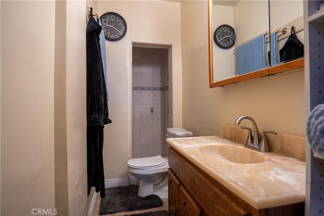 bathroom featuring toilet and vanity