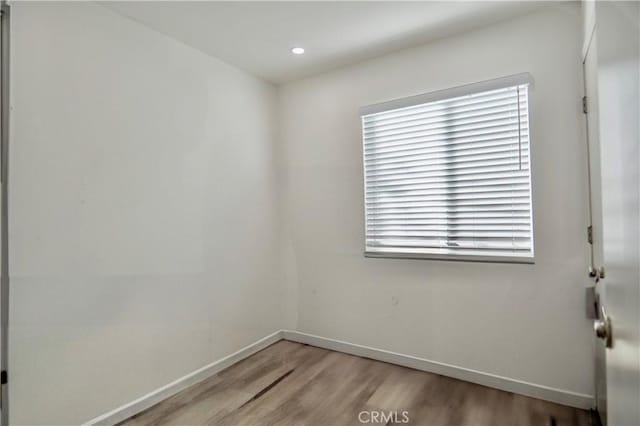 spare room featuring light wood-type flooring