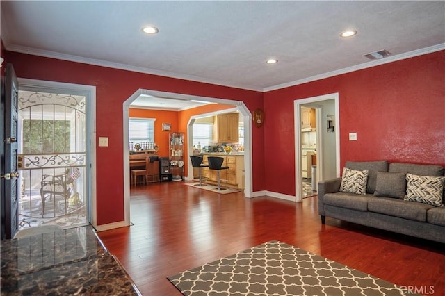 living room featuring ornamental molding and hardwood / wood-style floors