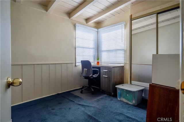 carpeted home office with lofted ceiling with beams