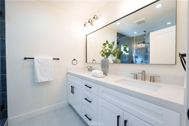 full bathroom with double vanity, visible vents, a shower stall, and a sink