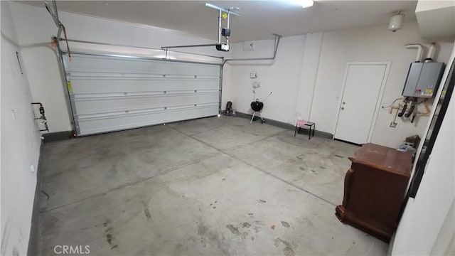 garage with water heater and a garage door opener