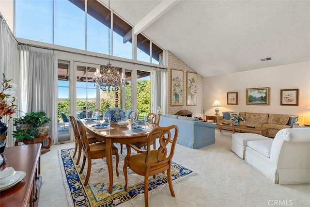 sunroom / solarium featuring vaulted ceiling with beams, a brick fireplace, visible vents, and a chandelier