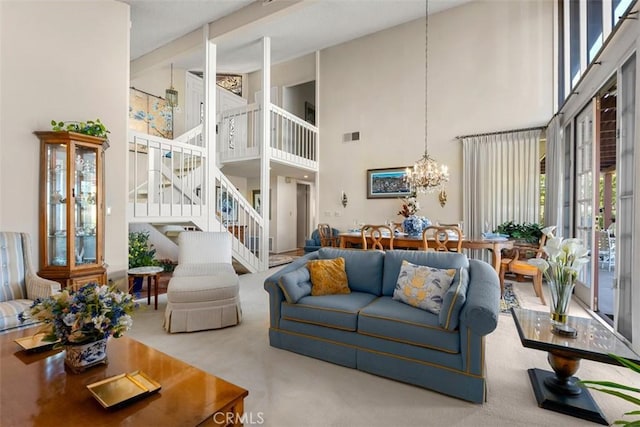 carpeted living room with stairway, a towering ceiling, visible vents, and a notable chandelier