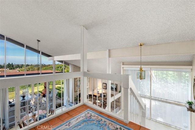 interior space with a chandelier and a wealth of natural light