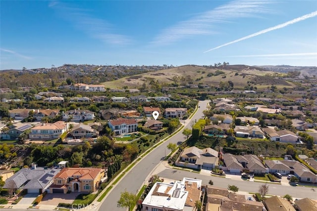 birds eye view of property with a mountain view and a residential view