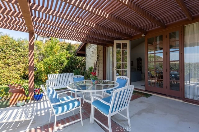 view of patio featuring outdoor dining space, french doors, and a pergola