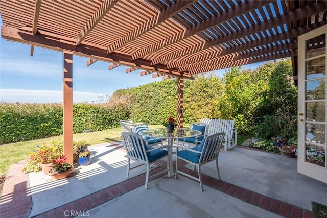 view of patio featuring a pergola and outdoor dining space