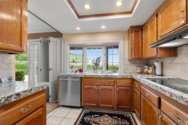 kitchen featuring brown cabinets, dishwasher, backsplash, and light tile patterned flooring