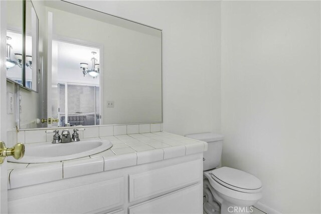 2061 W Redlands Blvd Unit 8C, Redlands, CA 92373 - bathroom featuring toilet and vanity