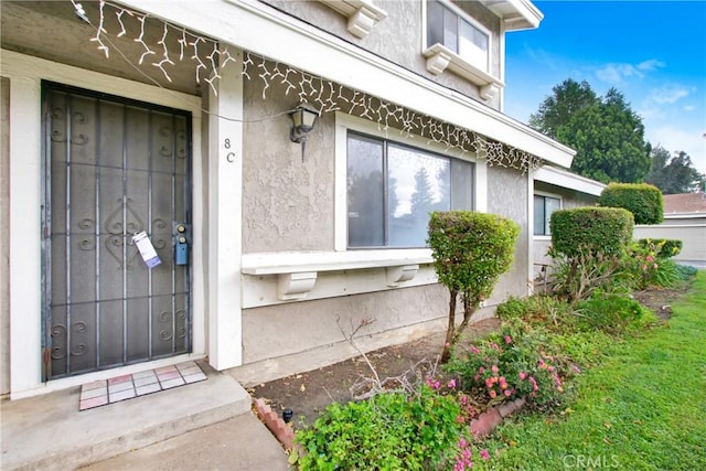 2061 W Redlands Blvd Unit 8C, Redlands, CA 92373 - view of exterior entry with stucco siding
