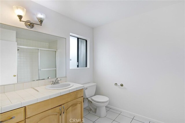 2061 W Redlands Blvd Unit 8C, Redlands, CA 92373 - full bathroom with vanity, tile patterned flooring, and a shower with shower door