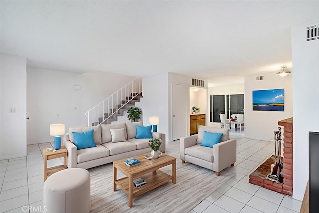 2061 W Redlands Blvd Unit 8C, Redlands, CA 92373 - living room with light tile patterned floors and stairway