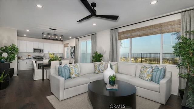 living room with dark wood-type flooring and ceiling fan