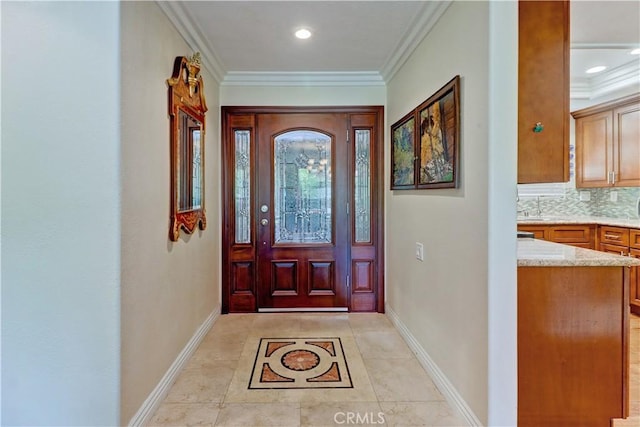 tiled foyer with ornamental molding