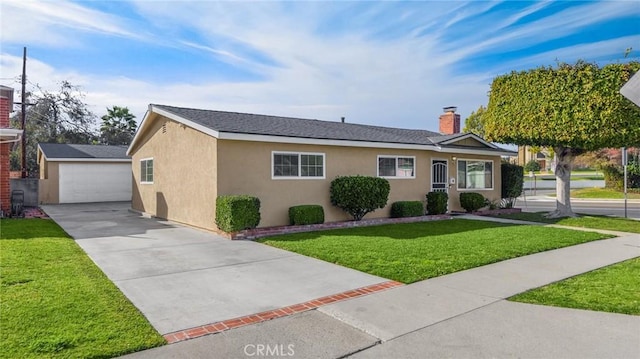 single story home with an outbuilding, a front lawn, stucco siding, and a chimney