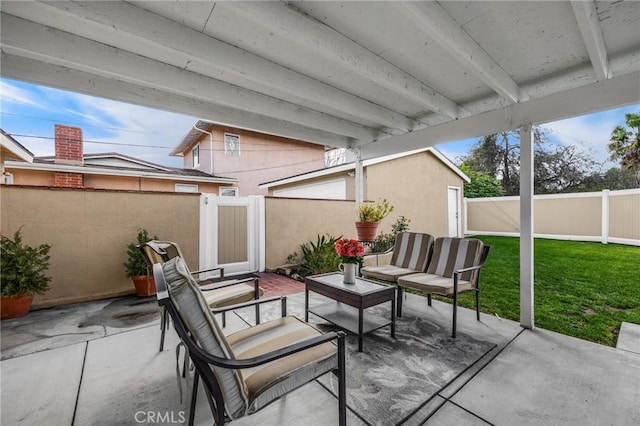 view of patio / terrace with an outdoor living space and a fenced backyard