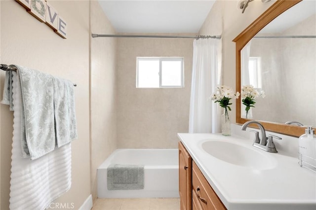 bathroom with tile patterned flooring, shower / bath combo with shower curtain, and vanity